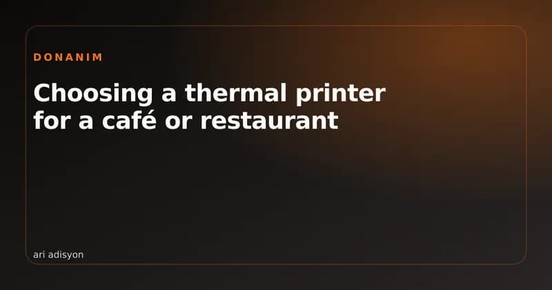 A thermal printer and a roll of receipt paper in a restaurant kitchen